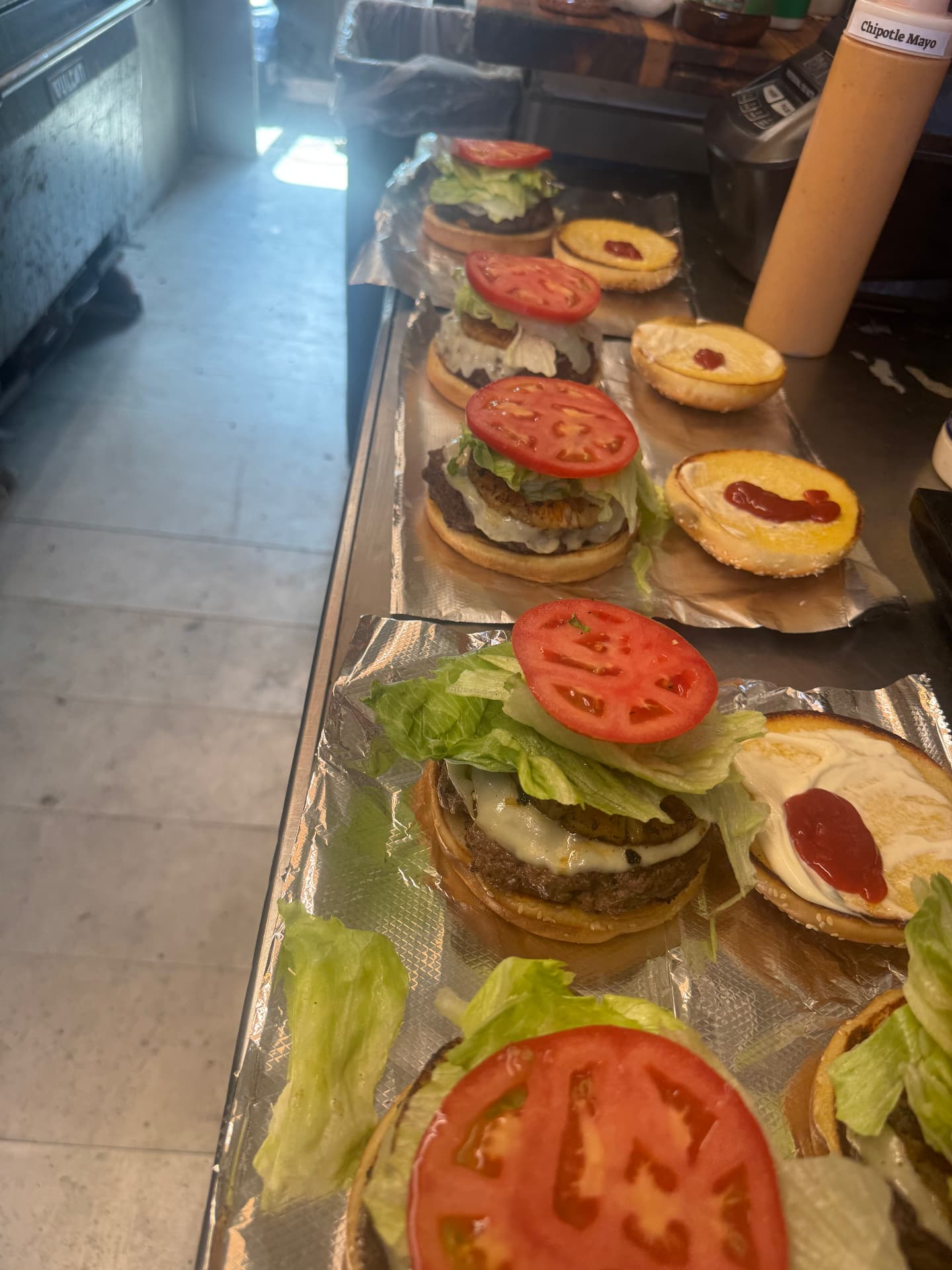 Burgers with lettuce and tomato ready to serve